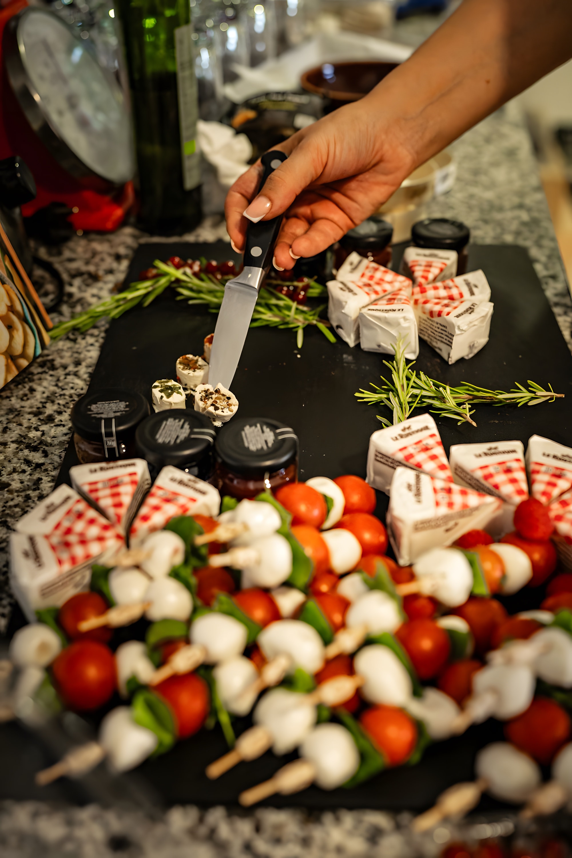 Caprese skewers and canapés being finished by hand