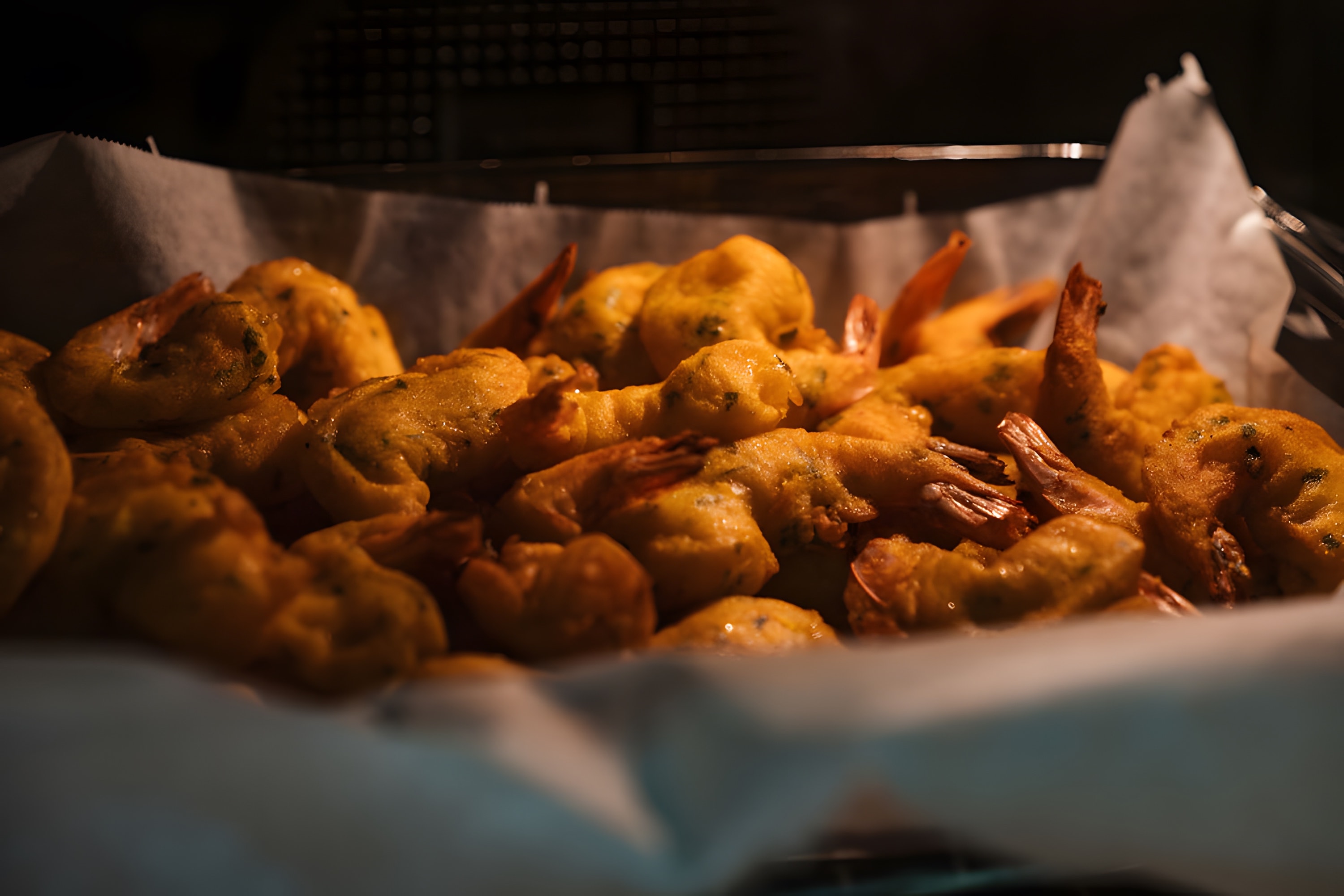 A basket of golden, freshly fried pastries